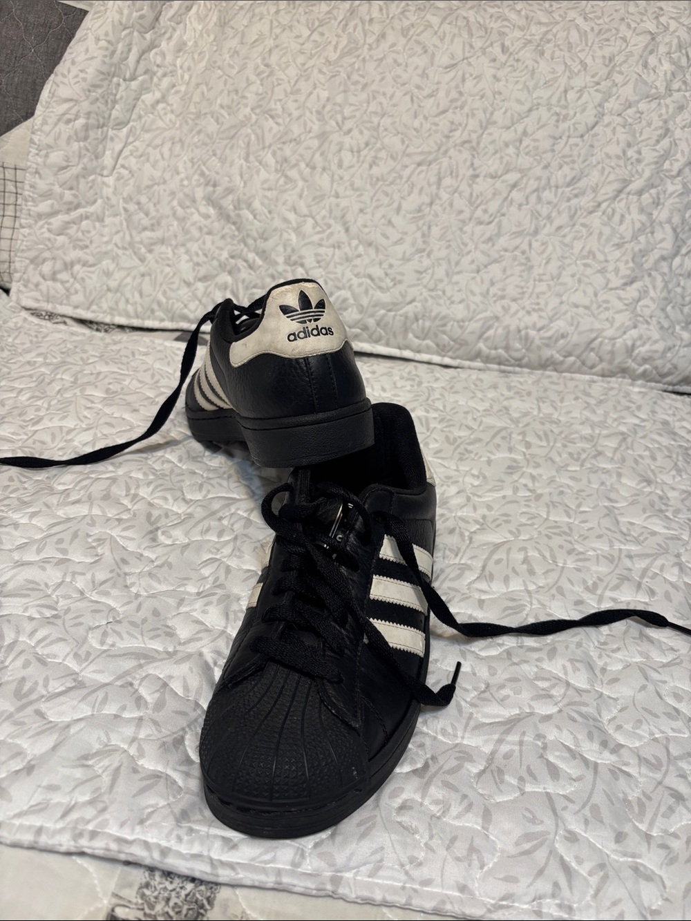 adidas women’s Black and White Superstar Sneakers